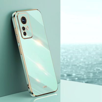 Mint green electroplate TPU phone case with gold trim, raised camera bezel, and cutouts