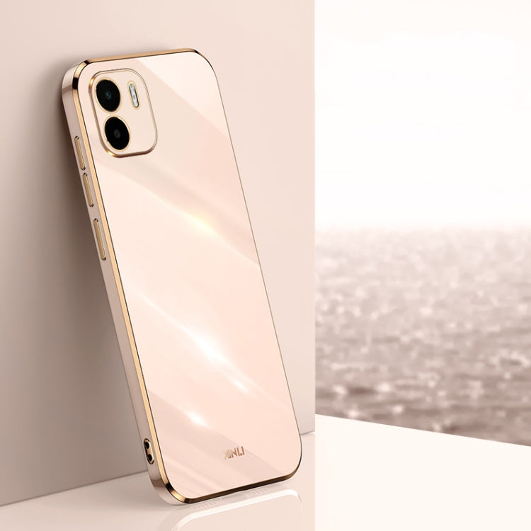 Light pink TPU phone case with gold straight-edge frame and dual camera cutouts
