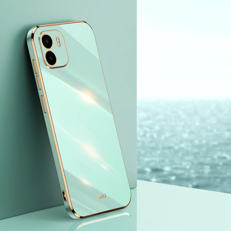 Mint green TPU phone case with gold straight-edge frame and dual camera cutouts