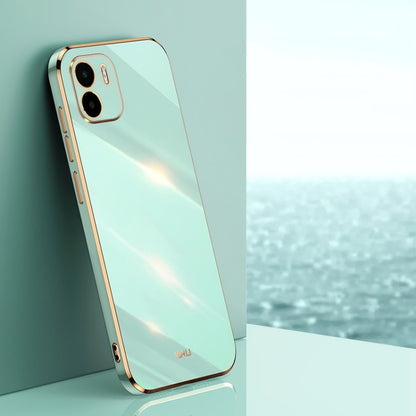 Mint green TPU phone case with gold straight-edge frame and dual camera cutouts