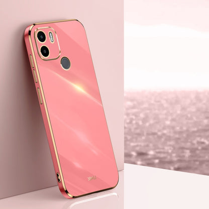 Bright coral pink TPU phone case with gold straight-edge frame and dual camera cutouts