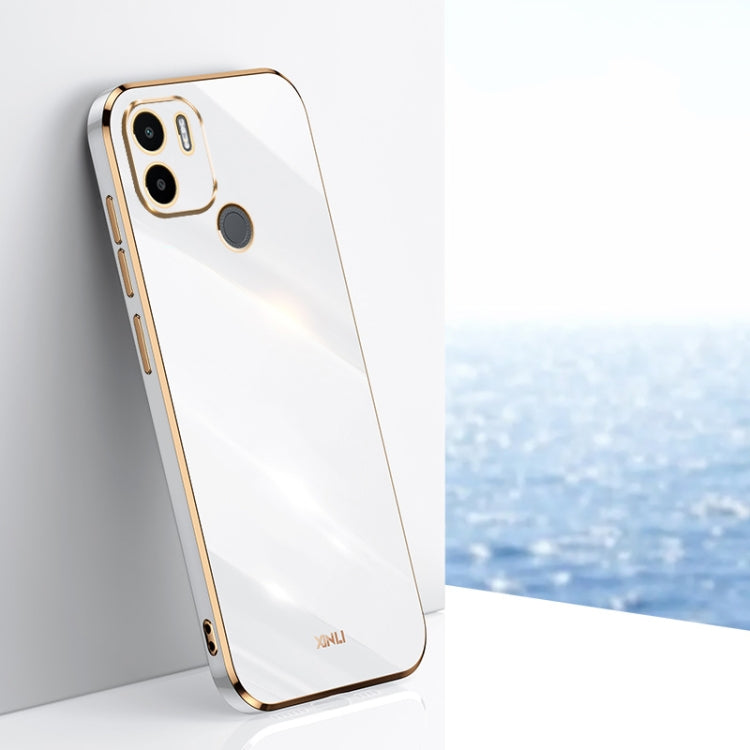White TPU phone case with gold-toned edges, raised camera and screen openings