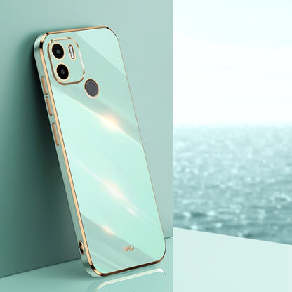 Mint blue TPU phone case with gold-toned edges, raised camera and screen openings
