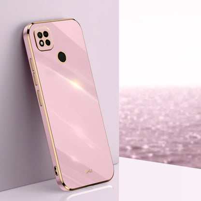 Soft pink TPU phone case with gold-toned edges, raised camera and screen openings
