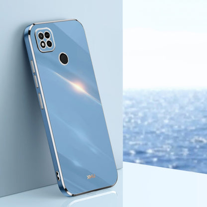 Sky blue TPU phone case with gold-toned edges, raised camera and screen openings