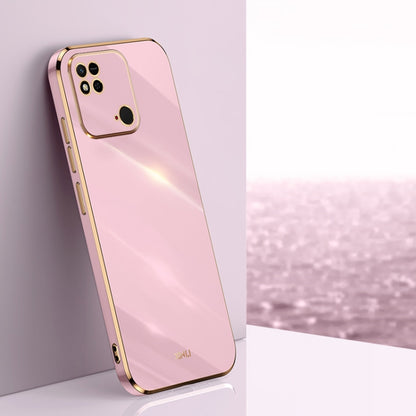 Pink TPU phone case with gold-tone straight edges, camera cutouts, and raised rim