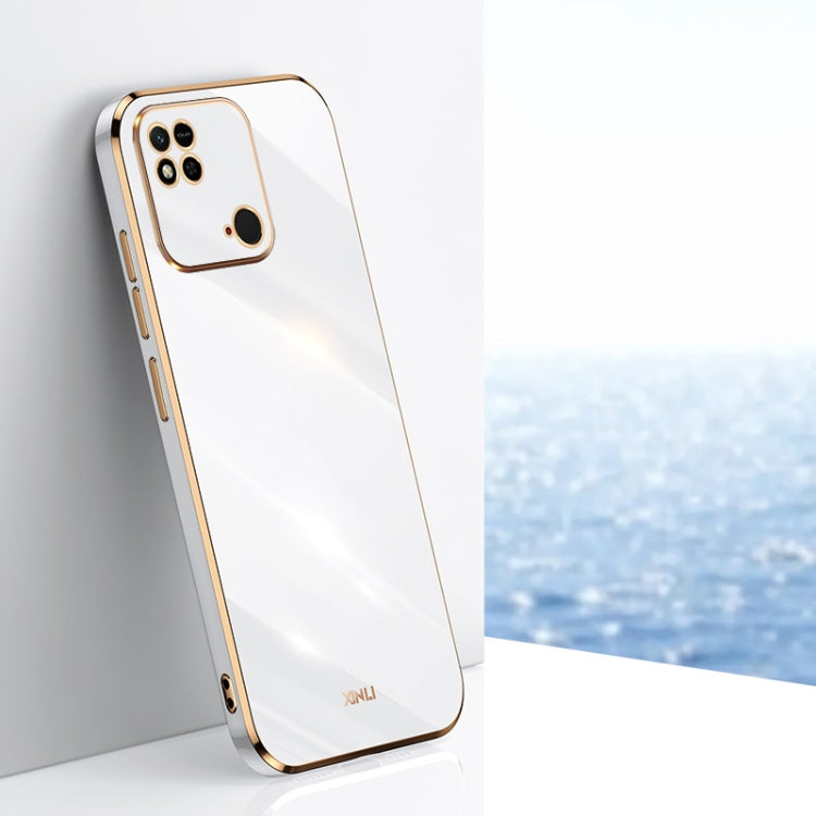 White TPU phone case with gold-tone straight edges, camera cutouts, and raised rim