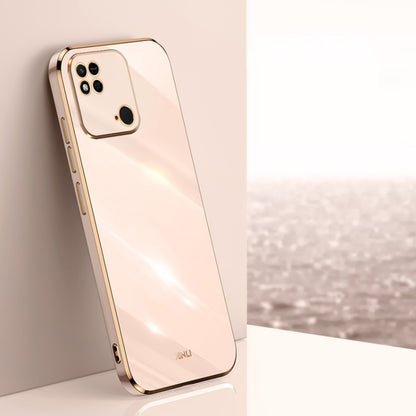 Light pink TPU phone case with gold-tone straight edges, camera cutouts, and raised rim