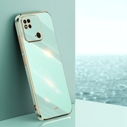 Mint green TPU phone case with gold-tone straight edges, camera cutouts, and rim