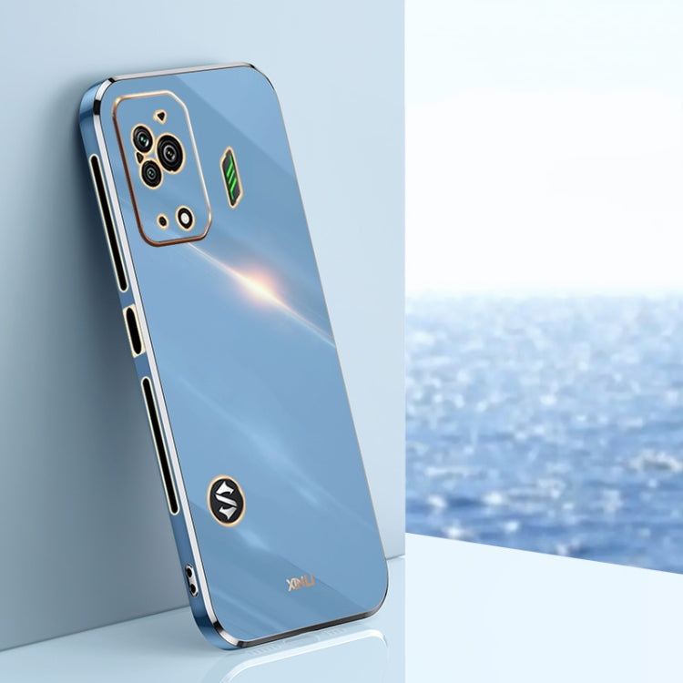 Celestial blue TPU phone case with gold-tone straight edges, camera cutouts, and icons