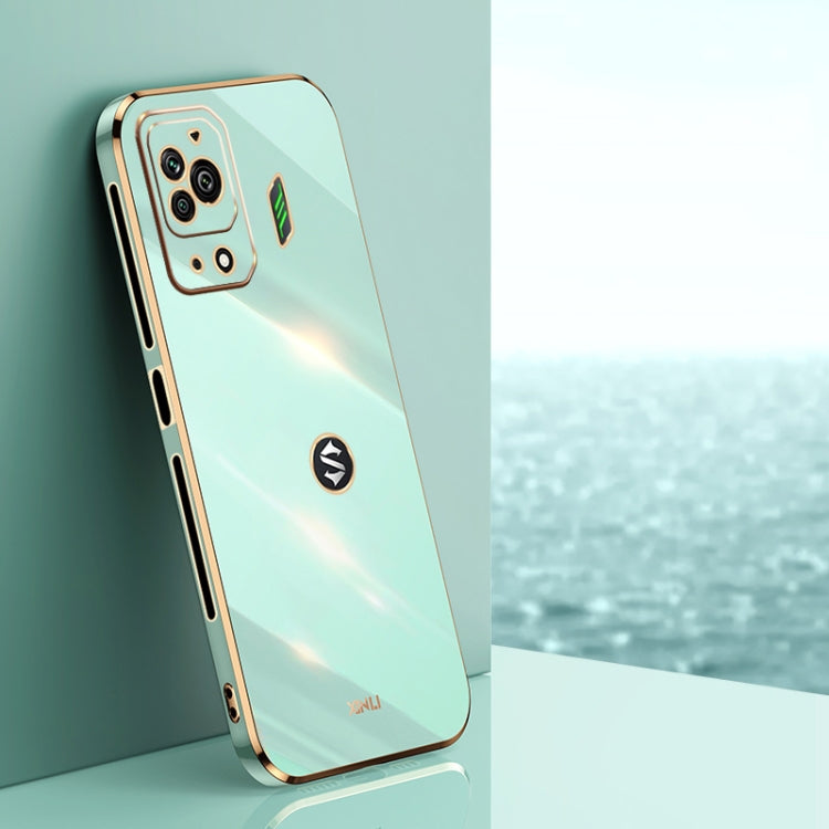 Mint blue TPU phone case with gold-tone electroplated edges and dual camera cutouts
