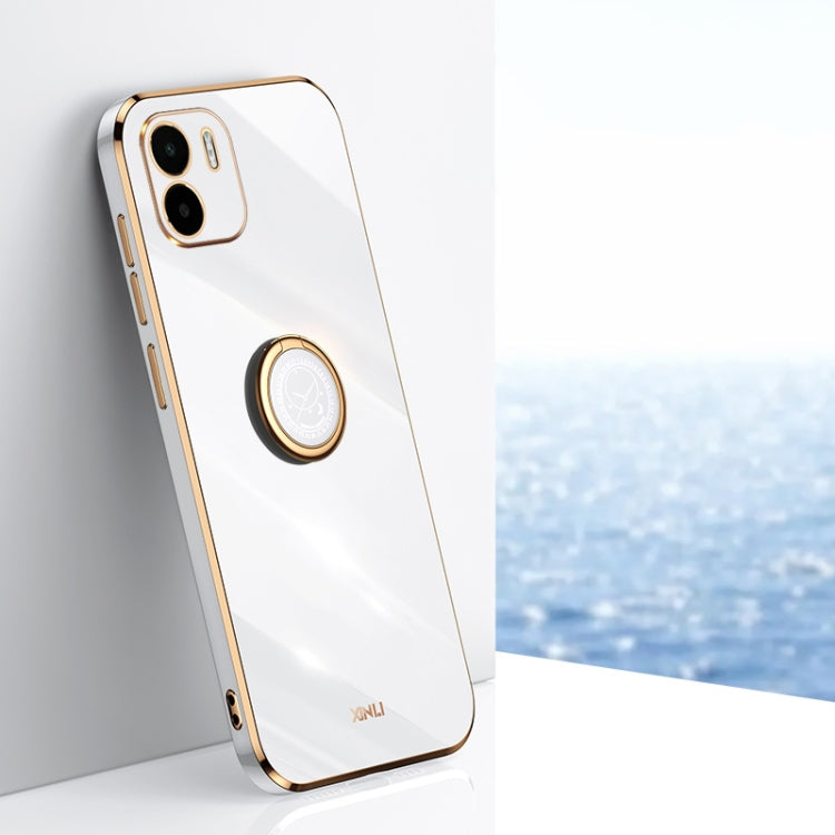 White TPU phone case with ring holder, gold trim, and camera cutouts