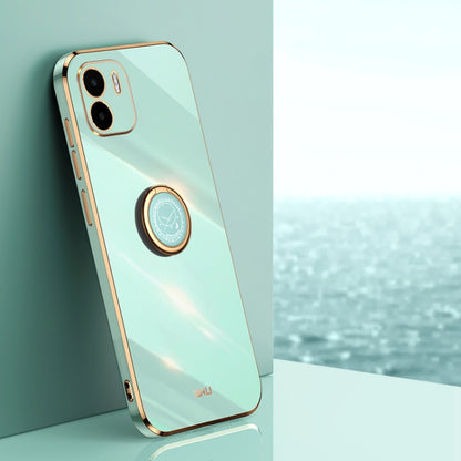 Mint green TPU phone case with ring holder, gold trim, and camera cutouts