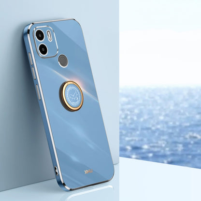 Sky blue TPU phone case with ring holder, gold trim, and camera cutouts