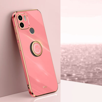 Pink TPU phone case with ring holder, gold trim, and camera cutouts