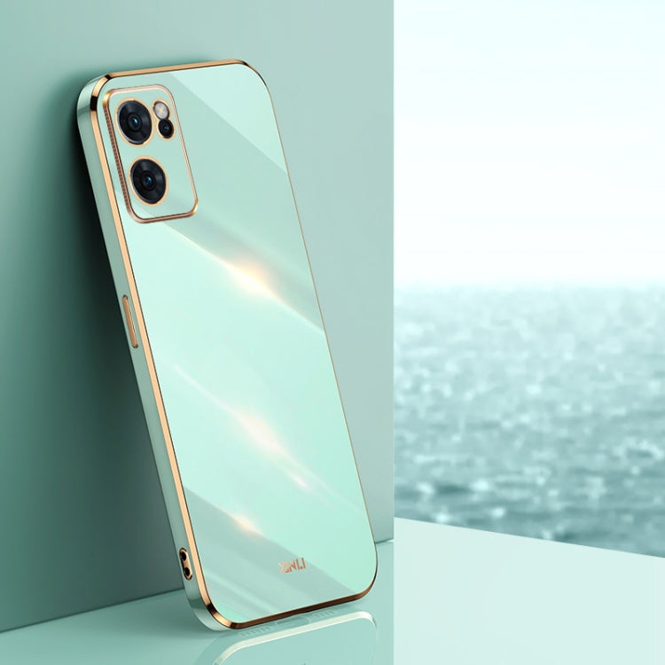 Mint green electroplate TPU phone case with gold straight edges and camera cutouts