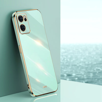 Mint green electroplate TPU phone case with gold straight edges and camera cutouts