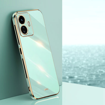 Mint green TPU phone case with gold edge, raised dual-camera bezel
