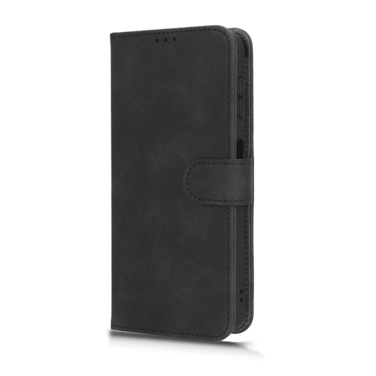 Black flip leather phone case, closed front with side strap and stitched flap panel