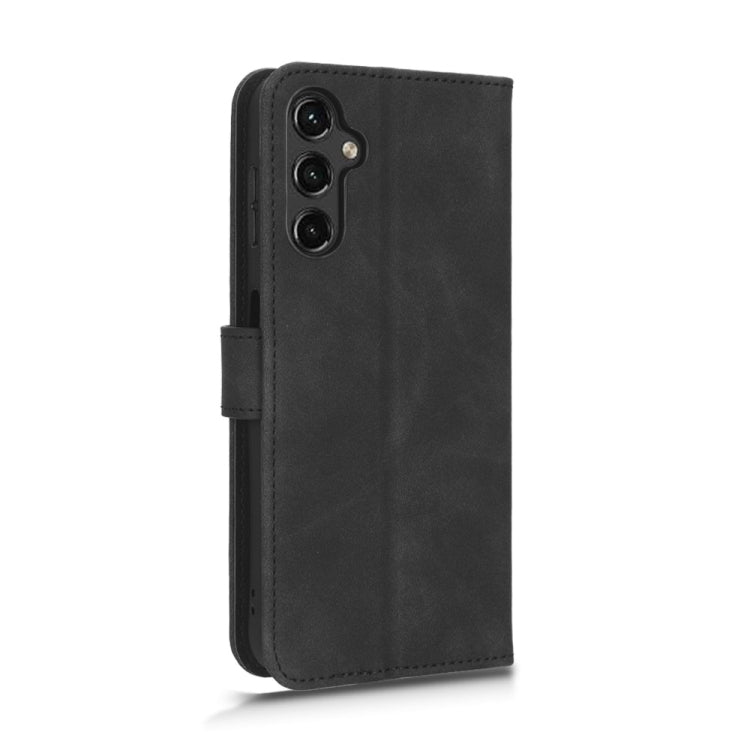 Black leather flip phone case with cutout openings and vertical strap on back