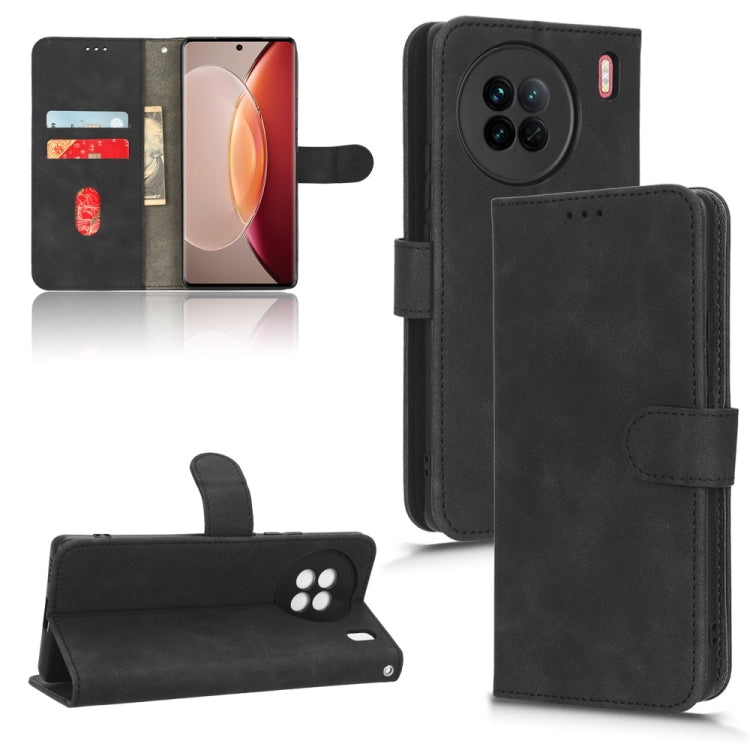 Black leather flip phone case with stitched front flap and side strap, phone secured inside