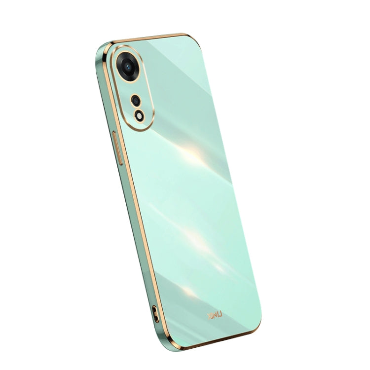 Electroplate TPU phone case in mint green with gold trim; dual camera cutouts.