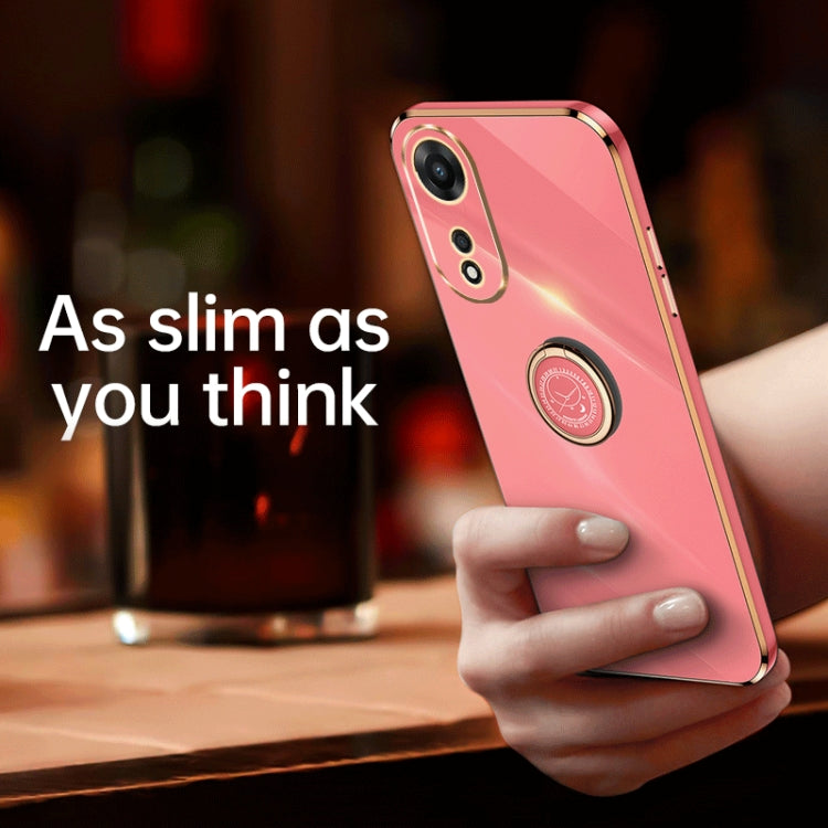Pink TPU phone case with gold ring holder, held in a hand