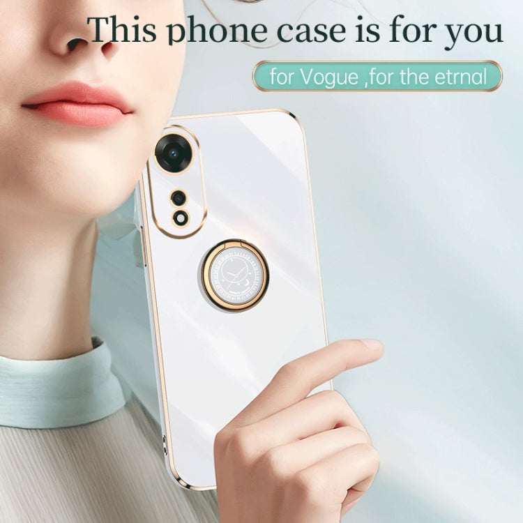 White TPU phone case with gold ring holder, close-up on a hand