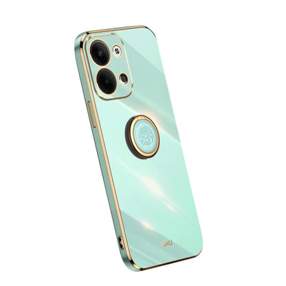 Mint green TPU phone case with ring holder and camera cutouts, electroplate trim