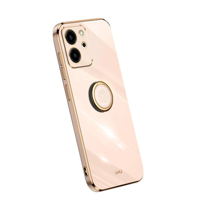 Peach TPU phone case with gold ring holder and camera cutouts
