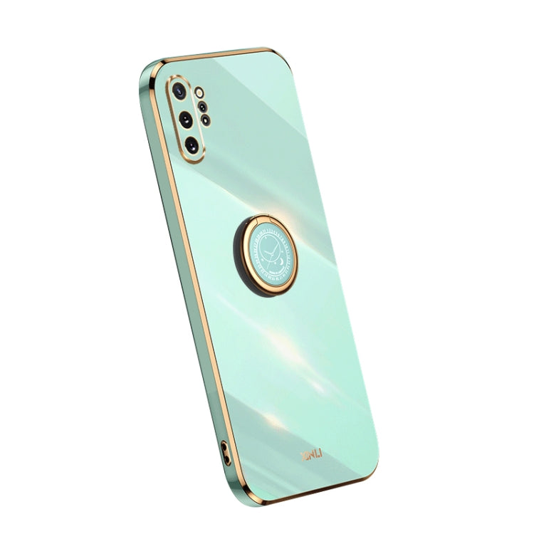 Mint blue TPU phone case with gold ring holder and camera cutouts