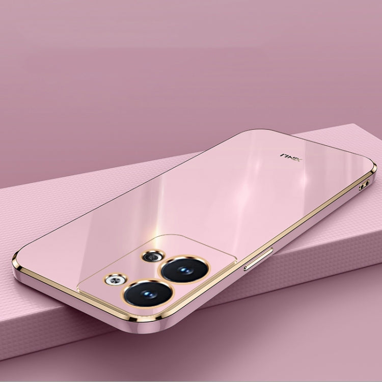 Light-pink TPU phone case with gold ring holder and triple camera cutouts
