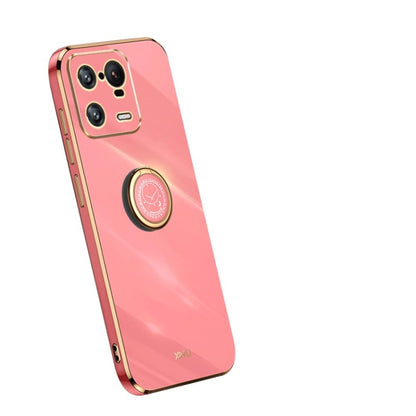 Pink TPU phone case with gold ring holder and camera cutouts