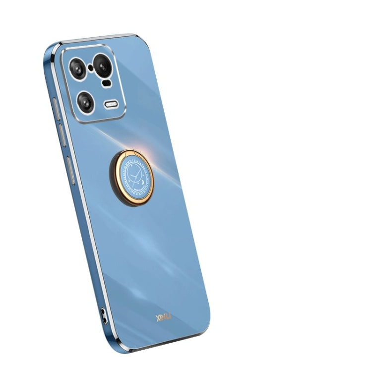 Blue TPU phone case with gold ring holder and camera cutouts