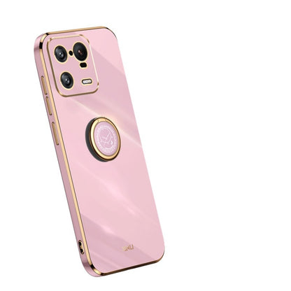 Pink TPU phone case with gold ring holder, angled back view