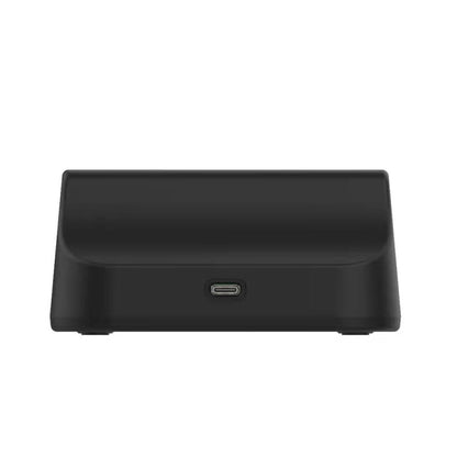 Black desktop charging dock with centered USB-C port on the front side