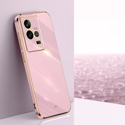 Pink TPU phone case with gold electroplated trim and triple camera cutouts.
