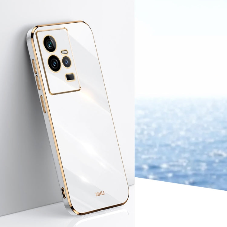 White TPU phone case with gold electroplated trim and triple camera cutouts.