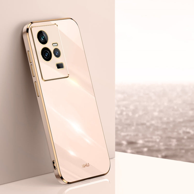 Champagne pink TPU phone case with gold electroplated trim and triple camera cutouts.