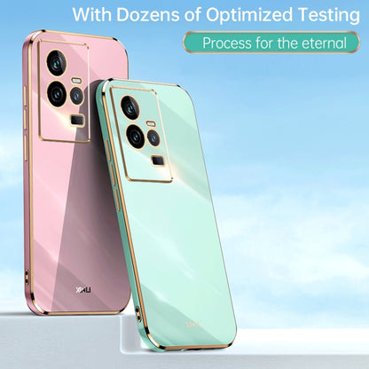 Electroplated TPU phone cases in pink and mint blue with gold-trim camera cutouts