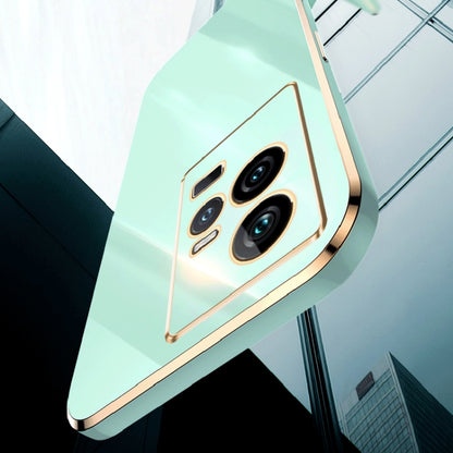 Mint green electroplated TPU phone case with gold trim and raised camera module