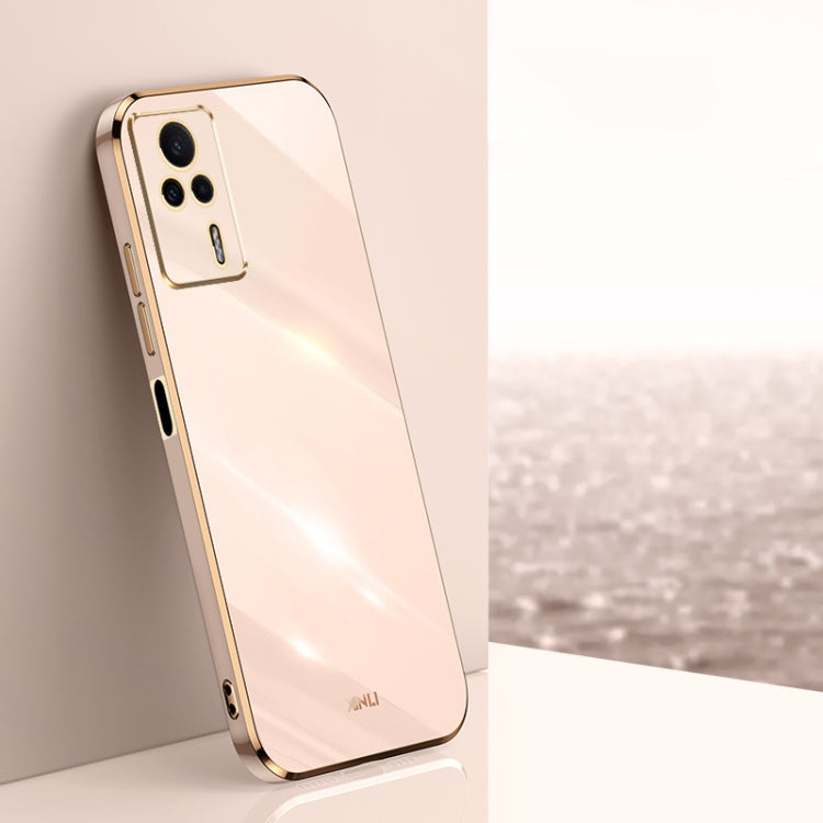 White electroplated TPU phone case with gold trim and camera cutouts