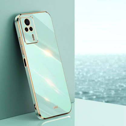 Mint blue electroplated TPU phone case with gold trim and camera cutouts