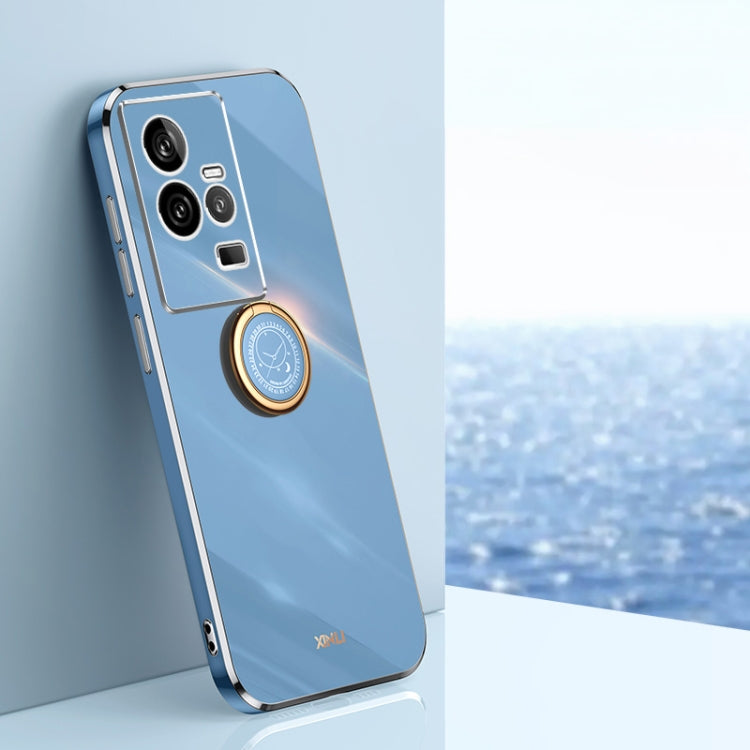 Blue TPU phone case with silver-toned electroplate edges and ring holder near camera