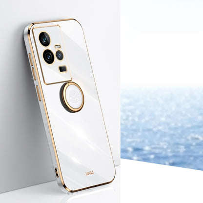 White TPU phone case with gold electroplate edges and ring holder near camera
