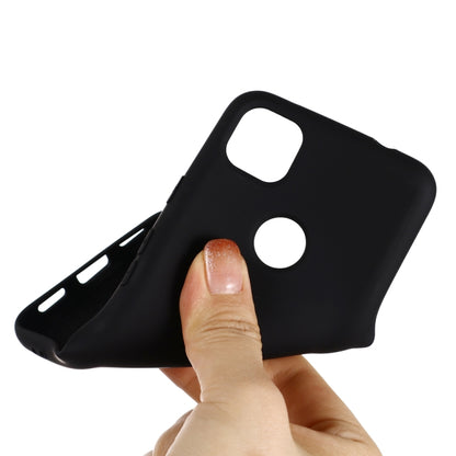 Black silicone phone case with raised edges for camera cutout and button access
