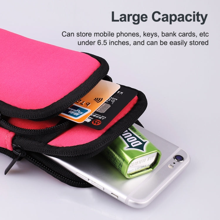Pink sports arm bag opening with phone and cards stored inside