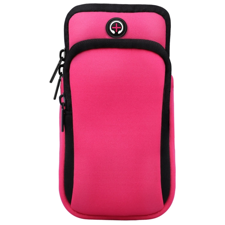 Pink sports arm bag with zipper pocket and headphone cable hole detail