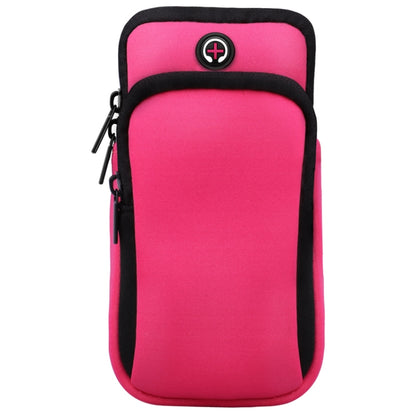Pink sports arm bag with zipper pocket and headphone cable hole detail