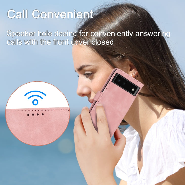 Pink flip phone case with speaker port, worn like a phone wallet